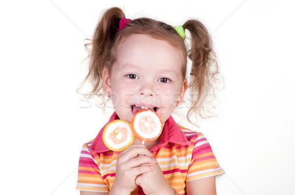 Cute fun little girl holding lolly pop  Stock photo © TarikVision
