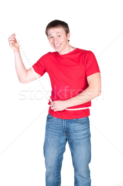 Attractive caucasian man is shocked with his new waistline measu Stock photo © TarikVision