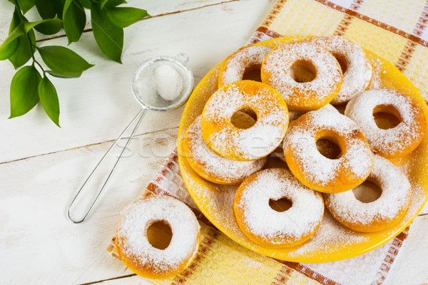 Sweet donuts powdered by caster sugar Stock photo © TasiPas