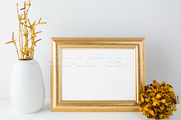 Landscape gold frame mockup with golden decor Stock photo © TasiPas