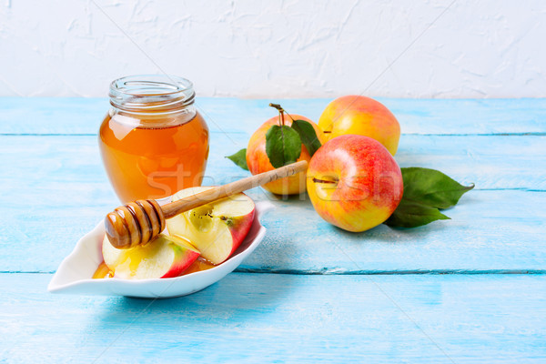 Honey jar and apple slices, copy space Stock photo © TasiPas