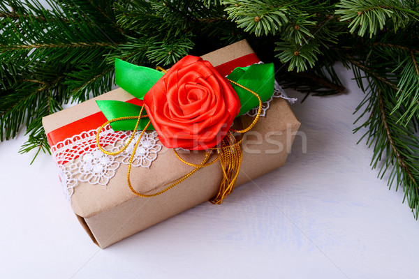 Christmas gift box decorated with lace and red silk rose Stock photo © TasiPas