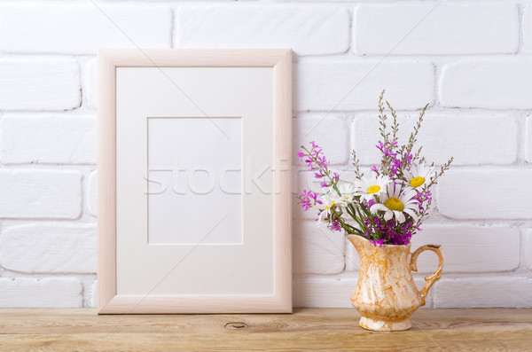 Wooden frame mockup with chamomile and purple flowers in golden  Stock photo © TasiPas