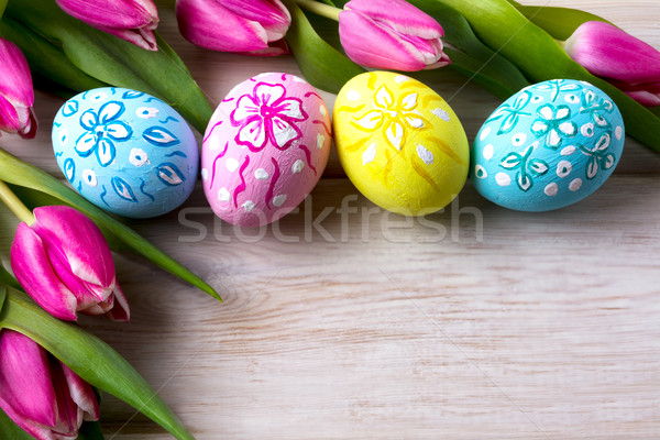 Easter floral ornated eggs  and pink tulips bouquet Stock photo © TasiPas