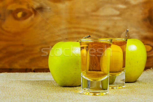 Two cider glasses  and green apples Stock photo © TasiPas