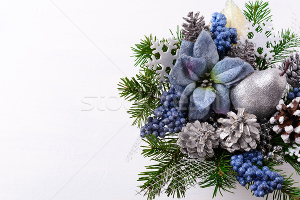 Christmas background with blue silk poinsettias and silver glitt Stock photo © TasiPas