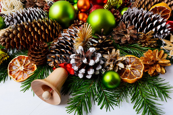 Christmas decoration with fir branches, pine cones and dried ora Stock photo © TasiPas