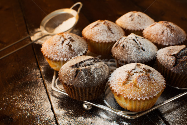 Muffins on metal stand Stock photo © TasiPas