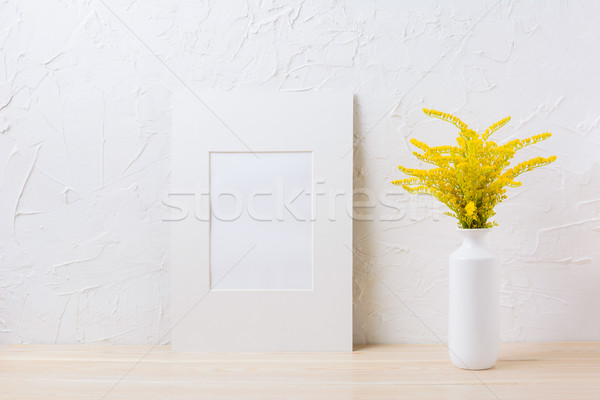 White mat frame mockup with ornamental yellow flowering grass in Stock photo © TasiPas