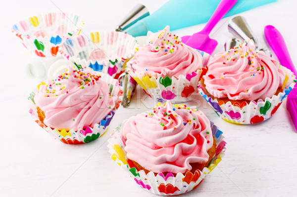 Homemade pink birthday cupcakes  and cookware Stock photo © TasiPas