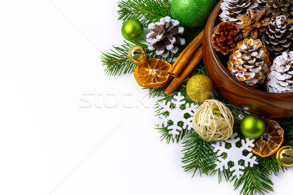 Christmas decorated pine cones in wooden bowl with fir branches Stock photo © TasiPas