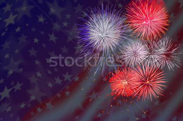 Celebration fireworks over American flag background Stock photo © TasiPas