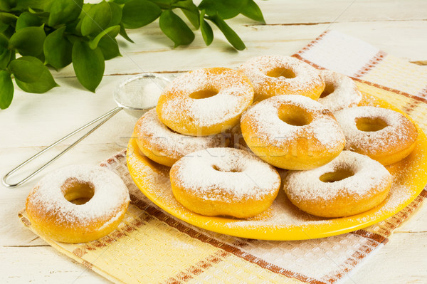 Donuts powdered by caster sugar  Stock photo © TasiPas