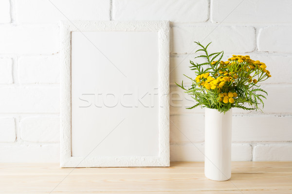 Download White Frame Mockup With Yellow Flowers Near Painted Brick Walls Stock Photo C Tasipas 7950994 Stockfresh PSD Mockup Templates