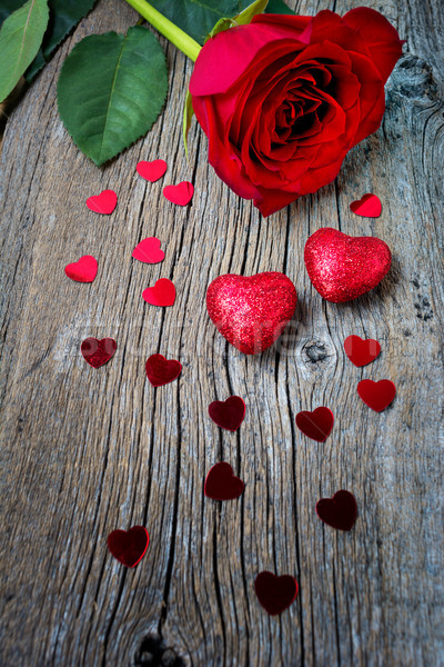 Valentines Day or wedding symbols one red rose and hearts Stock photo © TasiPas