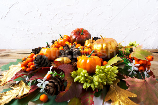Thanksgiving greeting background with pumpkins and leaves table  Stock photo © TasiPas
