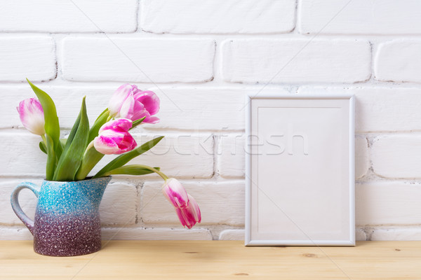 White small frame mockup with pink tulip in purple blue vase Stock photo © TasiPas
