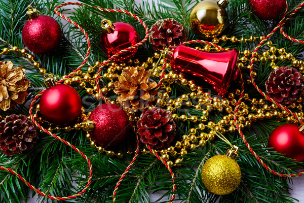 Christmas red ornaments with golden beads and fir branches  Stock photo © TasiPas