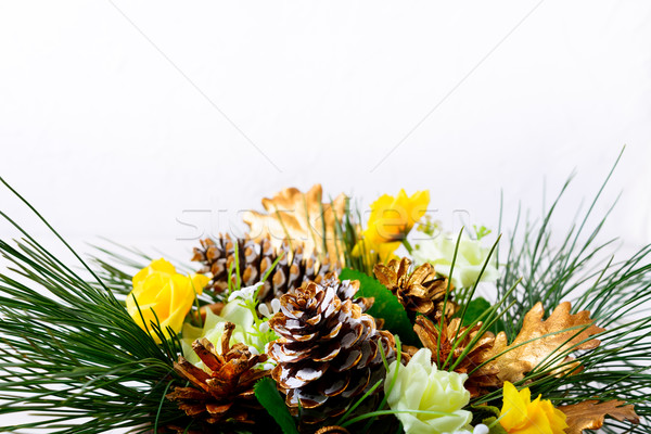 Christmas background with pine branches and golden fir cones Stock photo © TasiPas