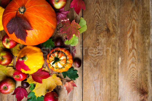 Chestnut, apples, pumpkins and maple leaves, copy space. Stock photo © TasiPas
