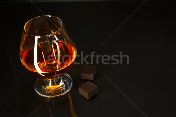 Brandy üveg csokoládé fekete konyak whiskey Stock fotó © TasiPas