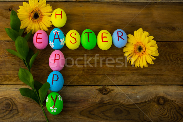 Stock photo: Easter eggs and yellow flowers