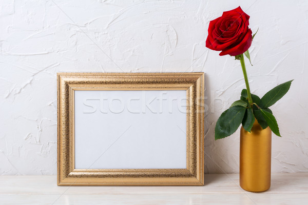 Landscape gold frame mockup with red rose in vase Stock photo © TasiPas