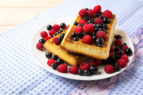 Soft Belgian waffles with blueberry, raspberry and blackcurrant Stock photo © TasiPas