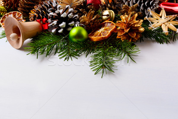 Christmas decoration with golden pine cones and handmade straw o Stock photo © TasiPas