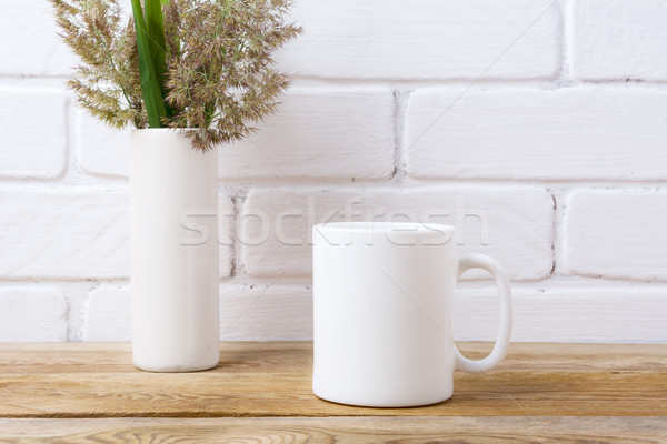 White coffee mug mockup with grass and green leaves in cylinder  Stock photo © TasiPas