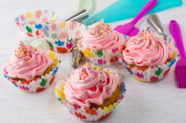 Stock photo: Pink cupcakes  and cookware