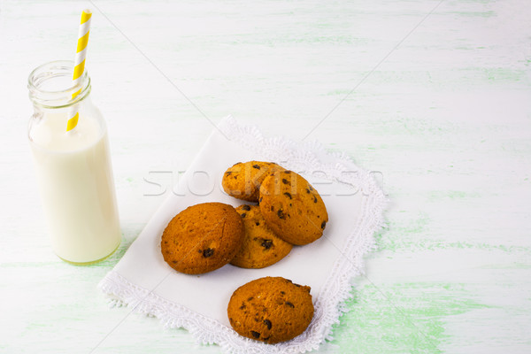 Milk bottle with straw and homemade cookies  Stock photo © TasiPas