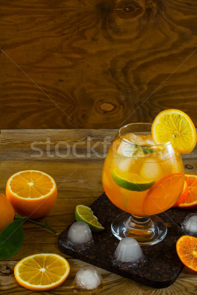 Summer fruit cocktail on wooden table, copy space Stock photo © TasiPas