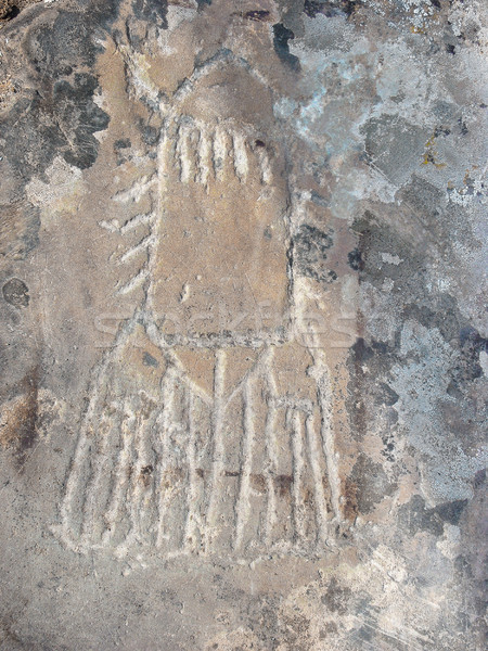 Rocket silhouette prehistorical petroglyph Stock photo © TasiPas