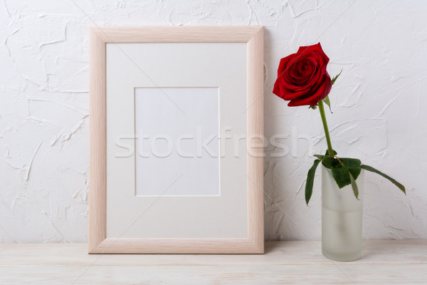 Wooden frame mockup with red rose in glass vase Stock photo © TasiPas