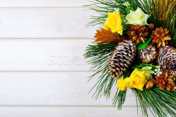 Christmas background with golden pine cones and yellow fabric ro Stock photo © TasiPas