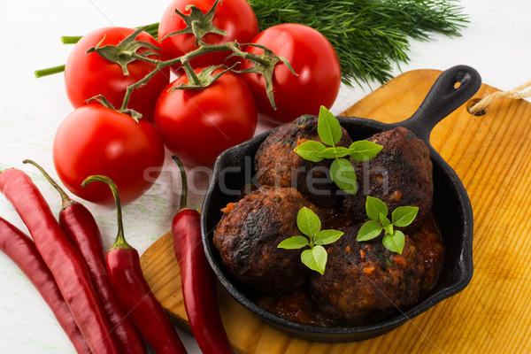 Grilled meatballs served in a skillet Stock photo © TasiPas
