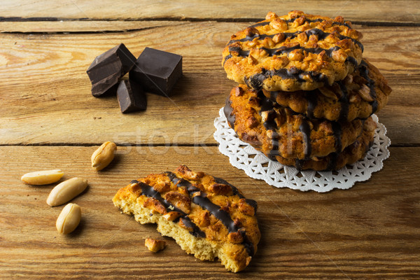 Stack of Homemade chocolate coating peanut cookies Stock photo © TasiPas