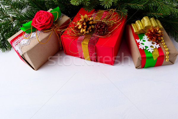 Christmas background with decorated gift boxes and Christmas tre Stock photo © TasiPas