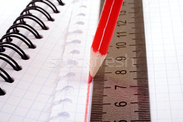 red pencil draws a flat line with a ruler Stock photo © Tatik22