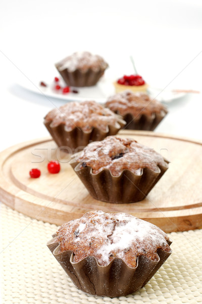 Stock photo: Some small round fruitcakes with raisin. 