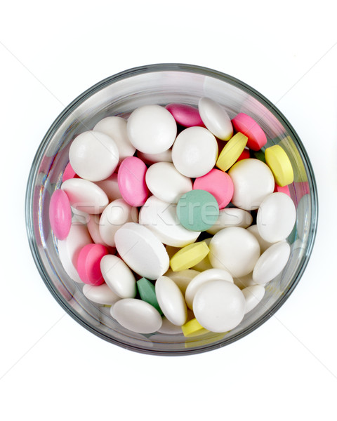 colored pills in a transparent glass on a white background, top  Stock photo © Tatik22