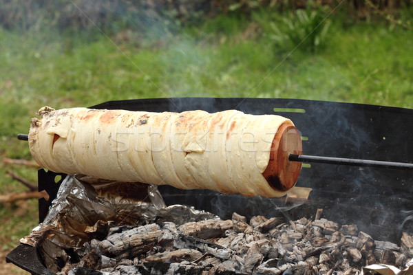 cooking kurtos kalacs on camp fire Stock photo © taviphoto