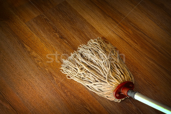 washing the wood floor with an old mop Stock photo © taviphoto
