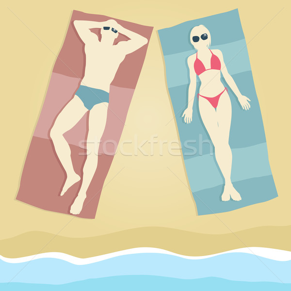 Szerkeszthető férfi nő napozás tengerpart törölközők Stock fotó © Tawng