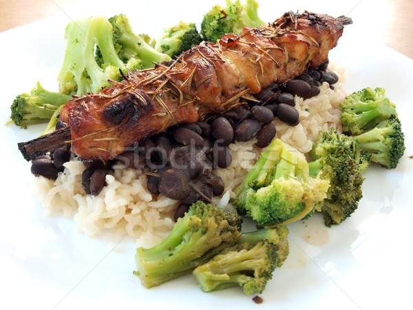 Porc longe grillés lit noir fèves Photo stock © tdoes