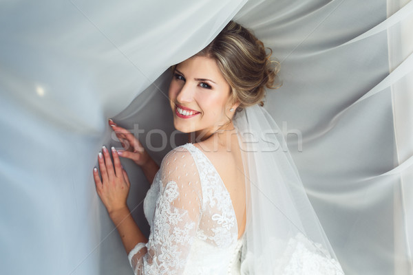 Bride posing in a hotel room Stock photo © tekso