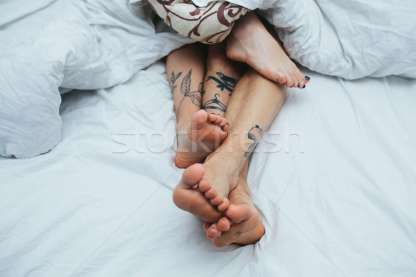 Young couple in bed together Stock photo © tekso