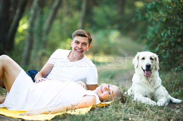 pregnant woman with husband lying in the park Stock photo © tekso