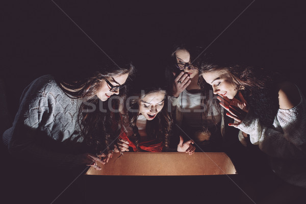 Sisters opens box with a Christmas present Stock photo © tekso